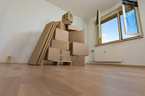 Boxes and furniture being loaded into a removal van