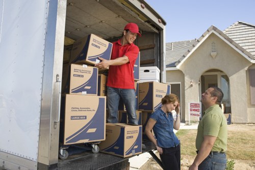 Local movers unloading belongings into a new Lambeth home