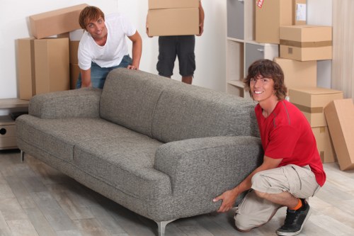 Local movers handling furniture for an urgent flat move