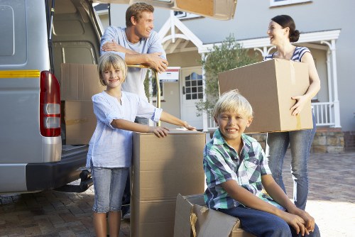 Local removal van team in Lambeth handling boxes and furniture with care